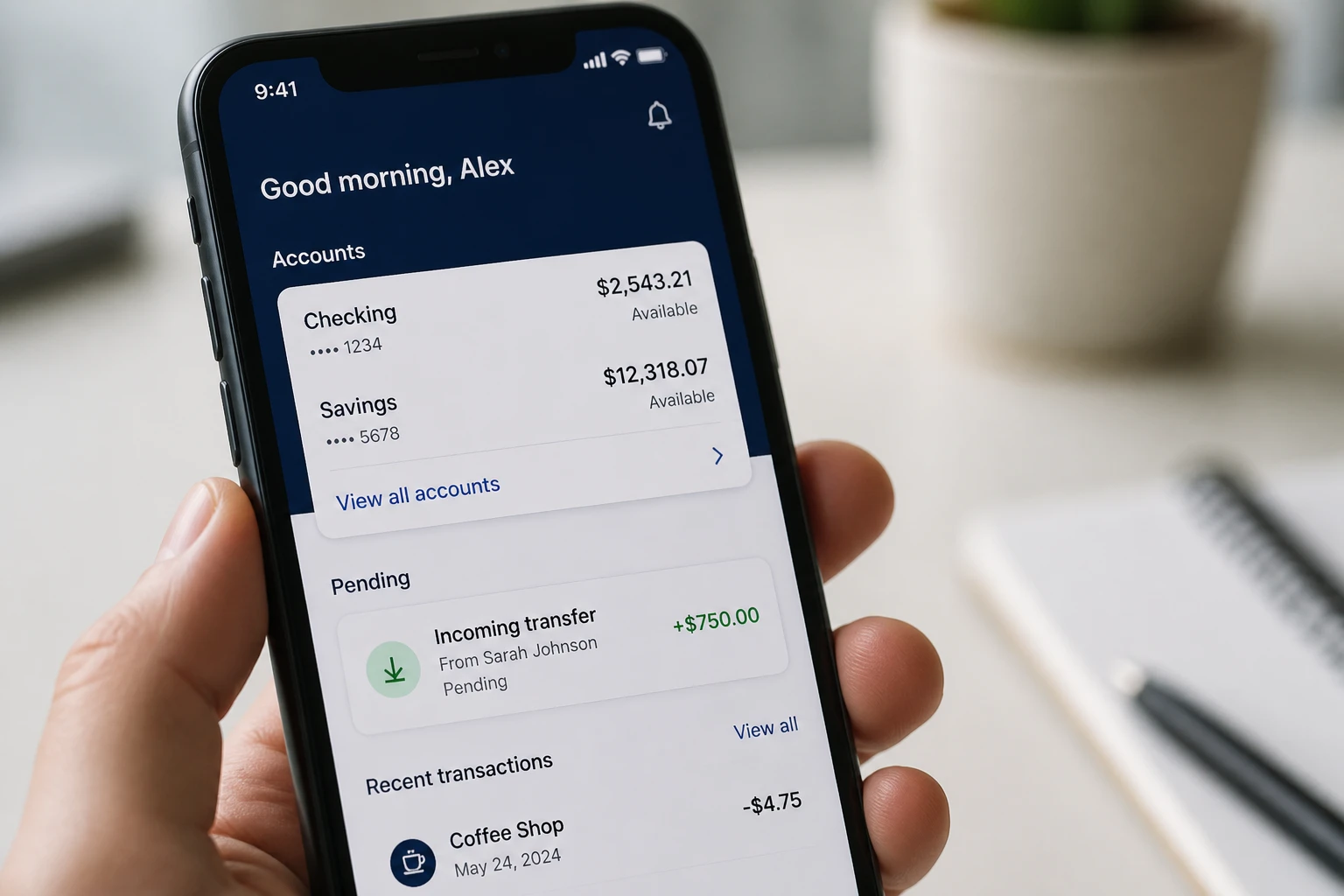 Smartphone affichant une notification de virement entrant sur une application bancaire mobile